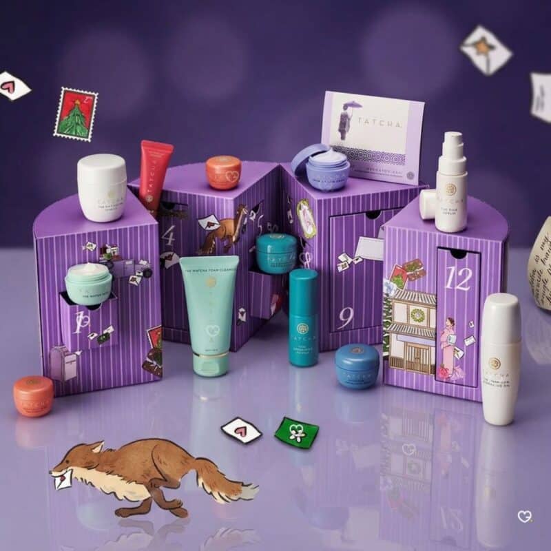 Tatcha skincare advent calendar 2026 open, showing the twelve miniature product drawers inside the purple chest