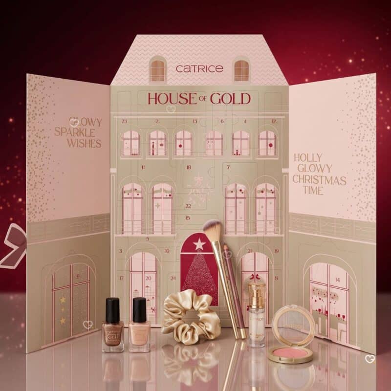 Catrice makeup advent calendar 2026 open, with two nail polishes, brushes, scrunchie and Duo Blush