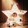 Dior Advent Calendar 2026 open, gingerbread-style scene with a floral couture gown and 24 numbered doors