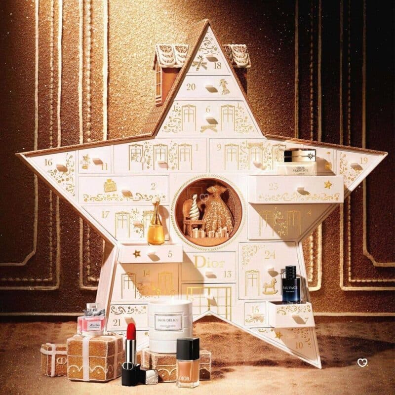 Dior Advent Calendar 2026 open, gingerbread-style scene with a floral couture gown and 24 numbered doors