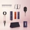 Dyson Advent Calendar 2026 contents spoiler flat lay: comb, hair clips, Supersonic Travel dryer, sprays, paddle brush, storage bag and Pre-Style Cream samples