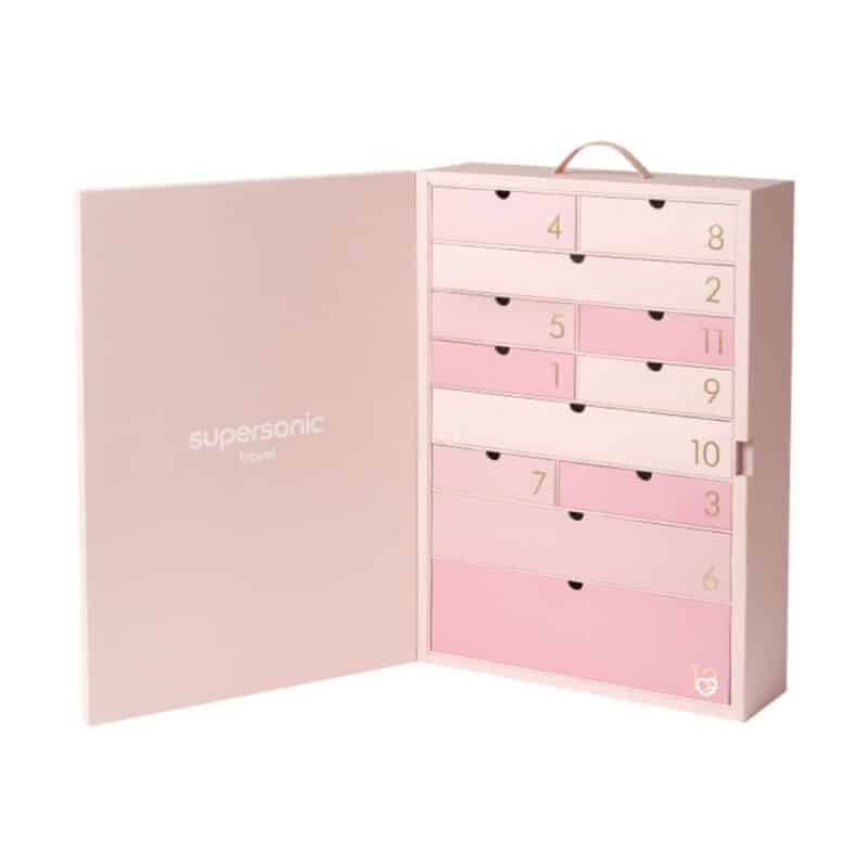Dyson Advent Calendar 2026 open box revealing 12 Supersonic Travel drawers in graduated pink