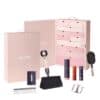 Dyson Advent Calendar 2026 opened showing its 12 numbered drawers with the dryer, brush, comb and styling products in front