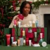 Elemis advent calendar for her 2026 styled by a Christmas tree with the open box