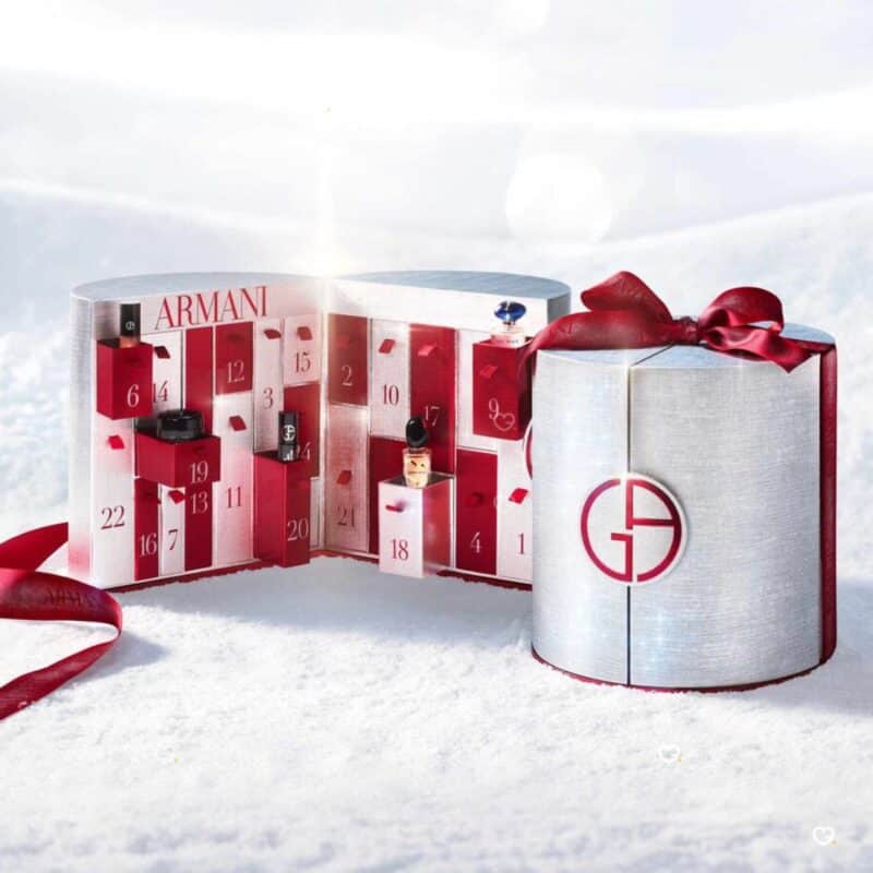 Giorgio Armani Advent Calendar 2026 shown open in a fan and closed, styled in a winter snow scene