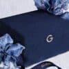 Guerlain Advent Calendar 2026 closed velvet jewellery box in a festive blue floral setting