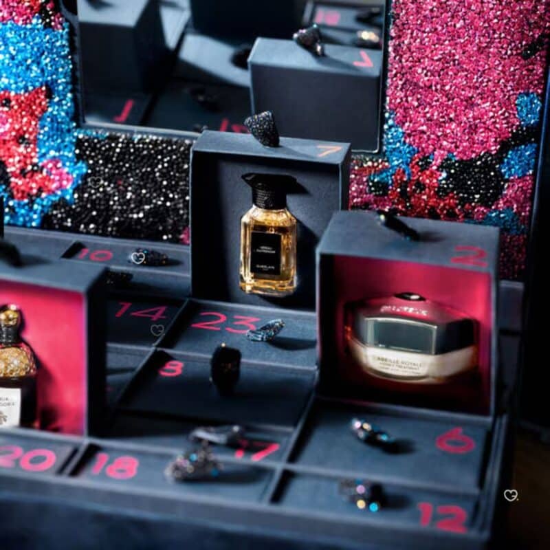Detail of the Guerlain Advent Calendar 2026 numbered drawers, with a Neroli Outrenoir fragrance and an Abeille Royale honey treatment
