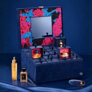 Guerlain Advent Calendar 2026 open, showing the colourful sparkling interior, mirror and numbered drawers with Guerlain products