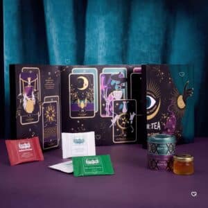 Kusmi Tea Advent Calendar 2026 open showing tarot cards, tea sachets and mini metal tins