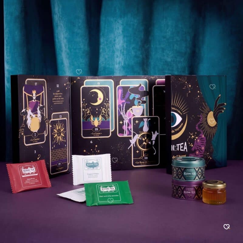 Kusmi Tea Advent Calendar 2026 open showing tarot cards, tea sachets and mini metal tins