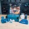 Makita Advent Calendar 2026 open case showing drill bits, desk calendar and beanie