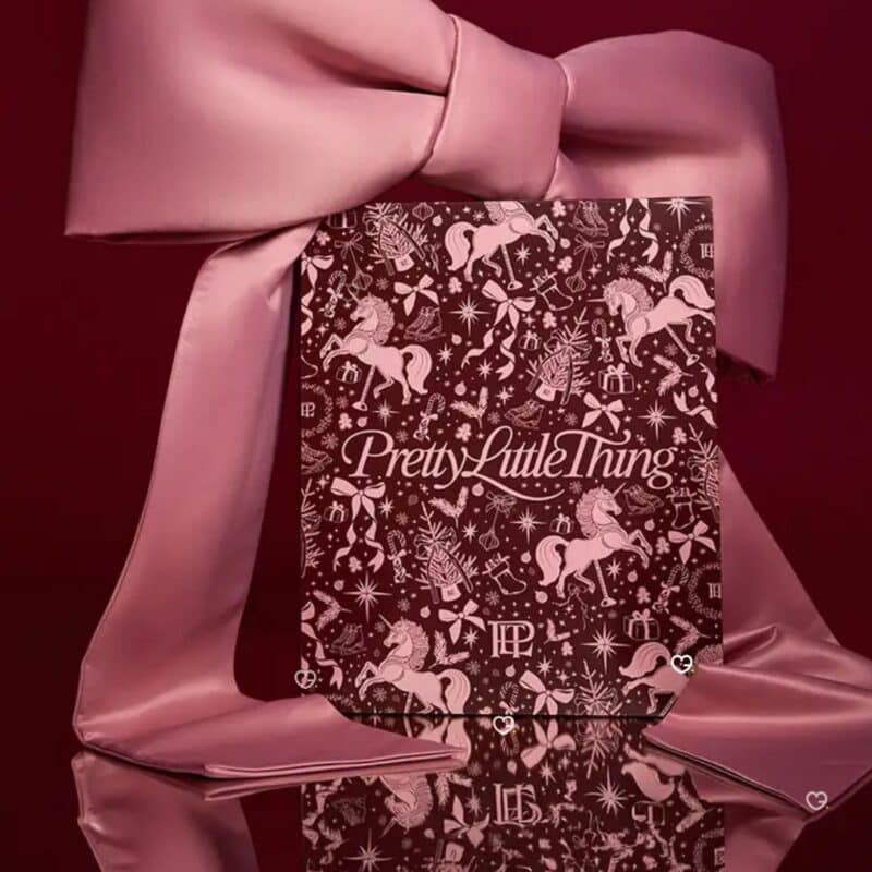 PrettyLittleThing Beauty Advent Calendar 2026 gift box tied with a pink satin ribbon