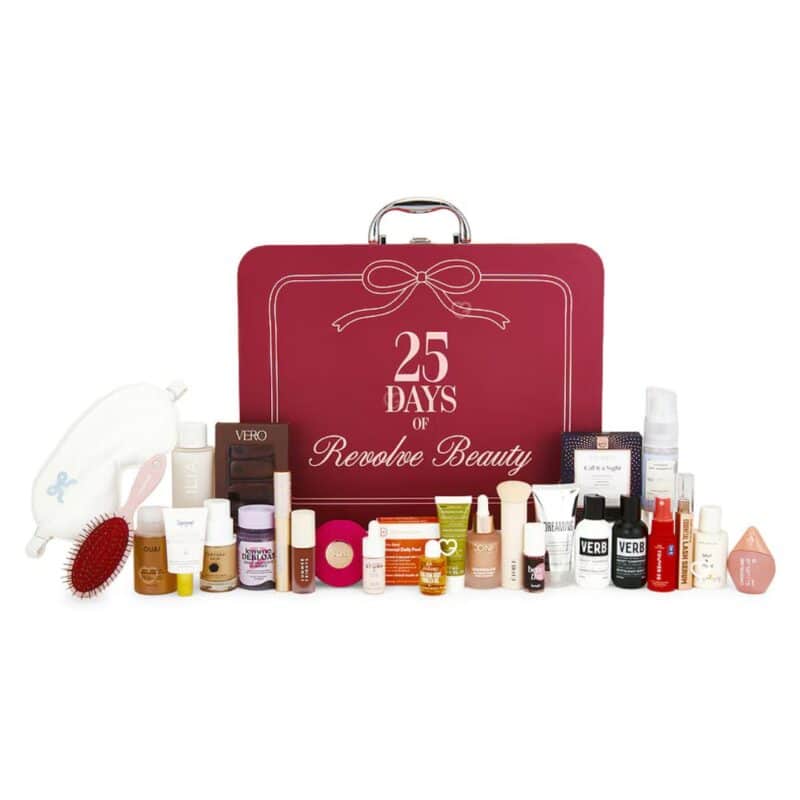 All 25 products of the Revolve Advent Calendar 2026 laid out beside the box