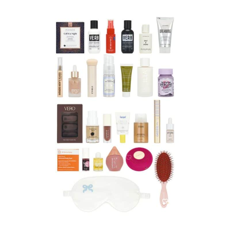 Flat lay of all 25 skincare and makeup products inside the Revolve advent calendar 2026