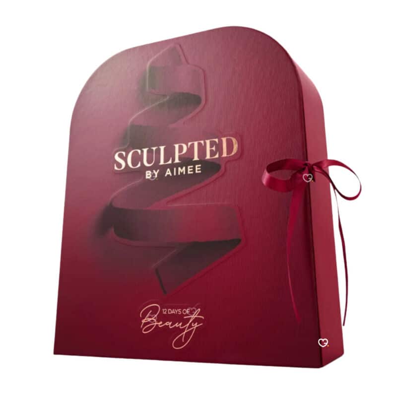 Sculpted By Aimee Advent Calendar 2026 closed box three-quarter view with burgundy ribbon