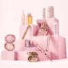 Sculpted By Aimee Advent Calendar 2026 beauty products styled on pink podiums