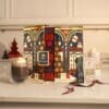 Whittard hot chocolate advent calendar opened on a kitchen counter with a mug of hot chocolate