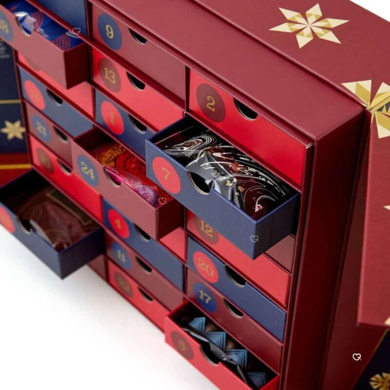 Open drawers of the Whittard hot chocolate advent calendar revealing numbered doors and sachets