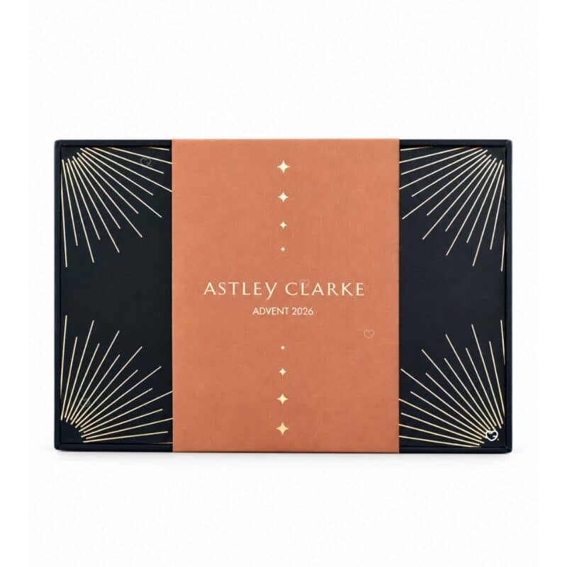 Astley Clarke Advent Calendar 2026 closed box with navy and copper sleeve