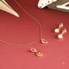 Gold moon pendant necklace and stud earrings from the Astley Clarke advent calendar