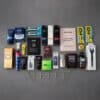 Full contents flatlay of the BoohooMAN Advent Calendar 2026 with 25 grooming products