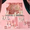 Cath Kidston Advent Calendar 2026 theatre folded out in 3D with the 24 bath and body products arranged in front, pink hero shot