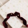 Orelia earring advent calendar 2026 box with burgundy velvet ribbon and two star stud earrings