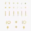 The full set of gold-plated earrings from the Orelia advent calendar 2026 laid flat, hoops and studs