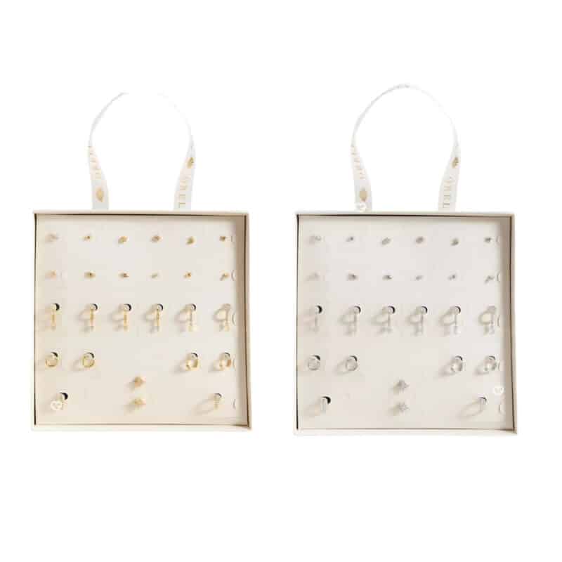 Two open Orelia advent calendars 2026, the gold and the silver editions side by side with their earrings