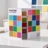 Pantone 2026 advent calendar open as a triptych standing on a designer desk