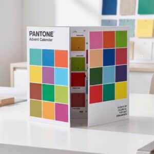 Pantone 2026 advent calendar open as a triptych standing on a designer desk