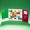 Pantone advent calendar 2026 open three-panel triptych on a green background
