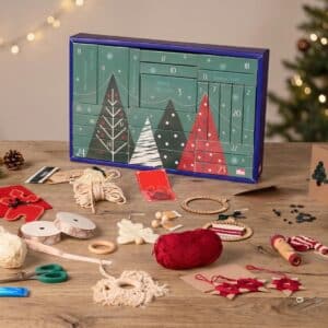 Prym DIY Advent Calendar 2026 styled on a table with wool, ribbons and finished Christmas makes