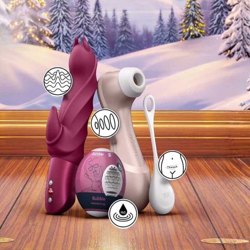 Satisfyer Pro 2 and toys from the Deluxe advent calendar in a festive winter setting