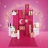 Valmont Advent Calendar 2026 open, showing its twelve skincare pieces and Rosa Fucsia candle