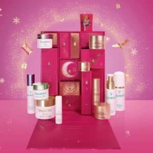Valmont Advent Calendar 2026 open, showing its twelve skincare pieces and Rosa Fucsia candle