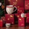 Villeroy & Boch Christmas Toys Memory porcelain mug beside the advent gift boxes