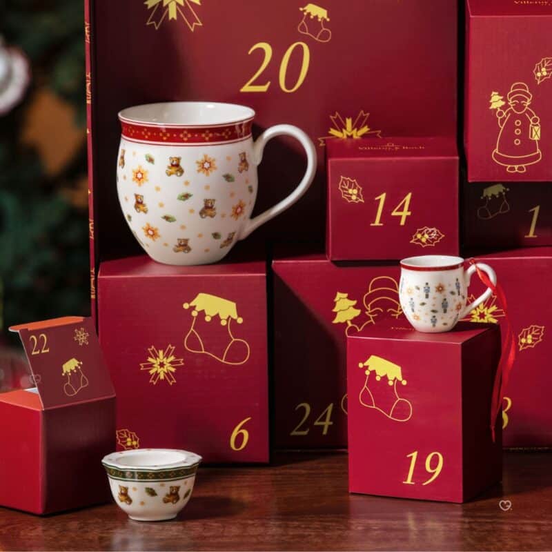Villeroy & Boch Christmas Toys Memory porcelain mug beside the advent gift boxes