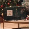 Yankee Candle Tree Advent Calendar 2026 Collector Edition box beside a Christmas tree